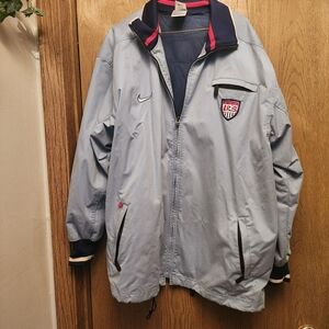 Nike Men's Light Blue Windbreaker with Navy Accents